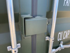 Heavy-duty steel locking box protecting the padlock hasp on ContainerKing® asset KNG72377, providing enhanced security for a premium one-trip shipping container.