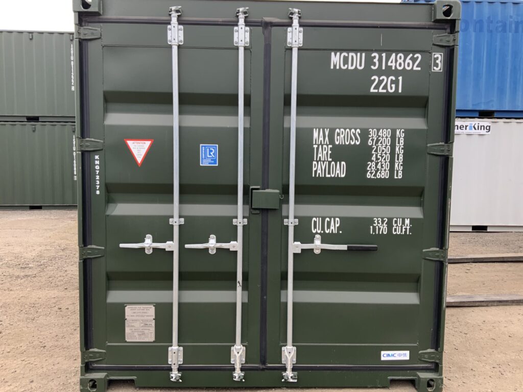 Front view of an immaculate one trip 20ft shipping container showing full double cargo doors, factory lock box, left-hand door bars and easy-open right-hand handle.