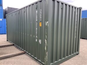 Bottle Green 20ft one-trip shipping container showing light cosmetic scratching to the corner pillars and a surface mark along the left-hand side panel.