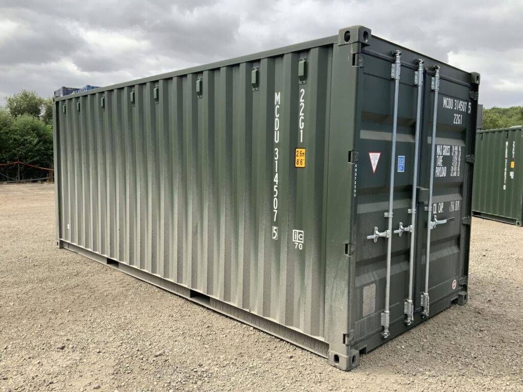 Premium bottle green RAL6007 one-trip 20ft ISO shipping container in excellent condition awaiting final professional hot jet wash preparation.