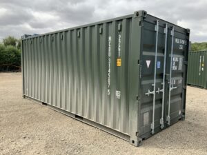 Premium bottle green RAL6007 one-trip 20ft ISO shipping container in excellent condition awaiting final professional hot jet wash preparation.