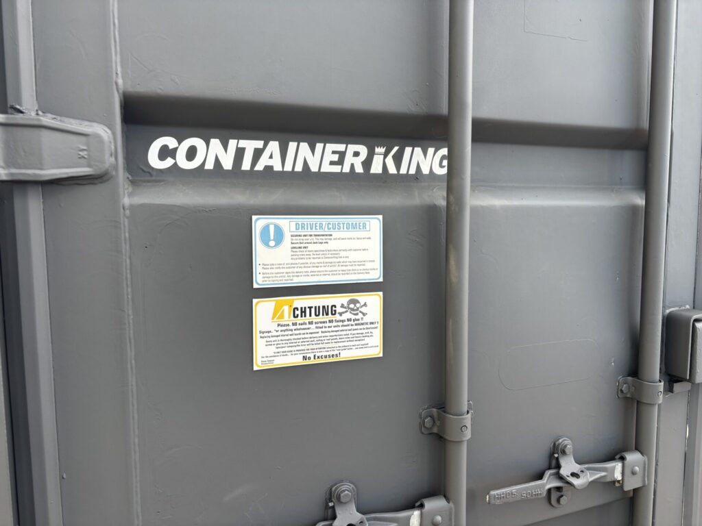 Freshly painted matt anthracite 20ft used ISO shipping container KNG71085 showing tidy external condition and secure double cargo doors.