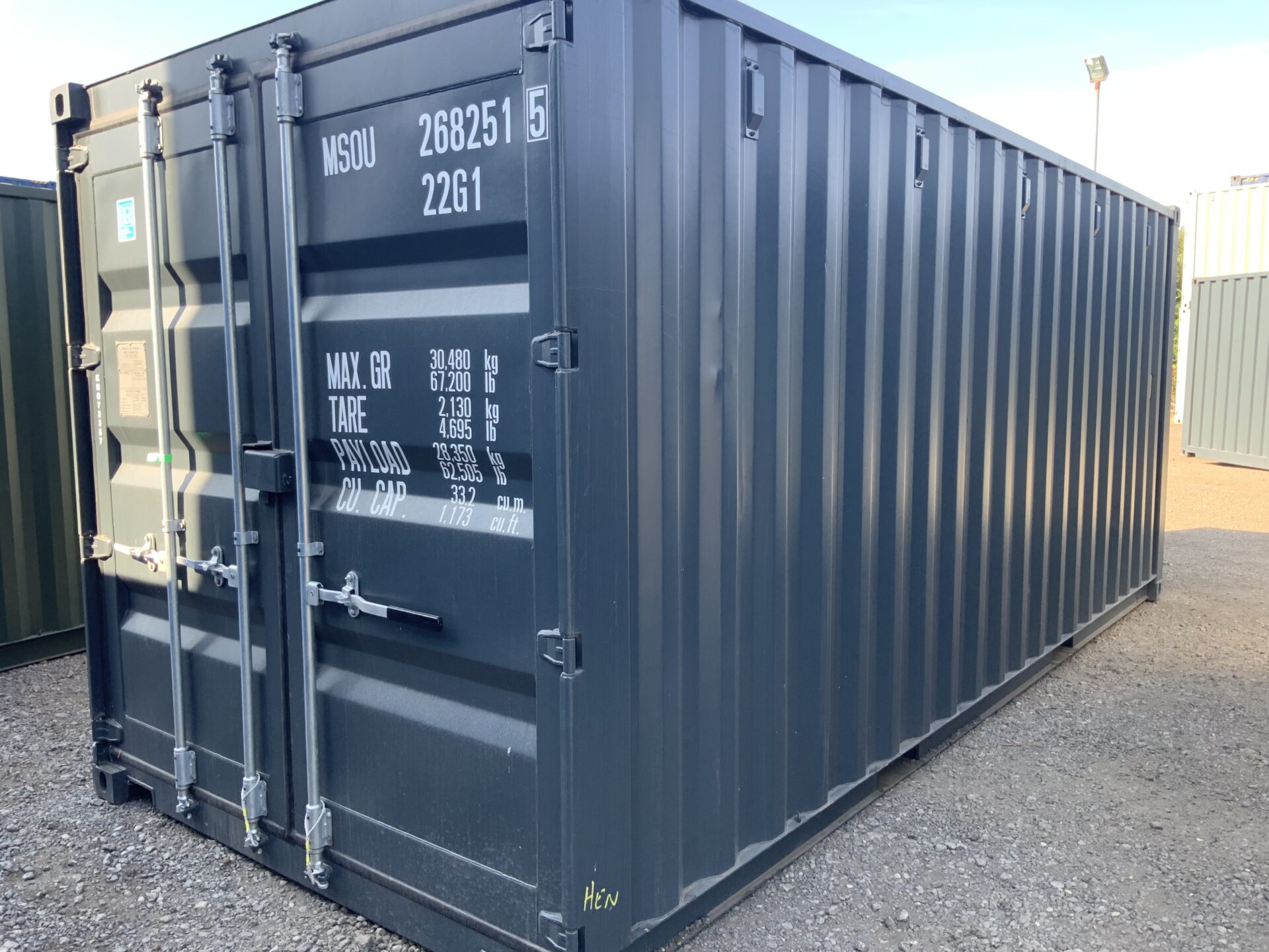 Brand new light grey 20ft one-trip ISO shipping container KNG72387 viewed from the front and side in the ContainerKingยฎ depot, Lincolnshire.