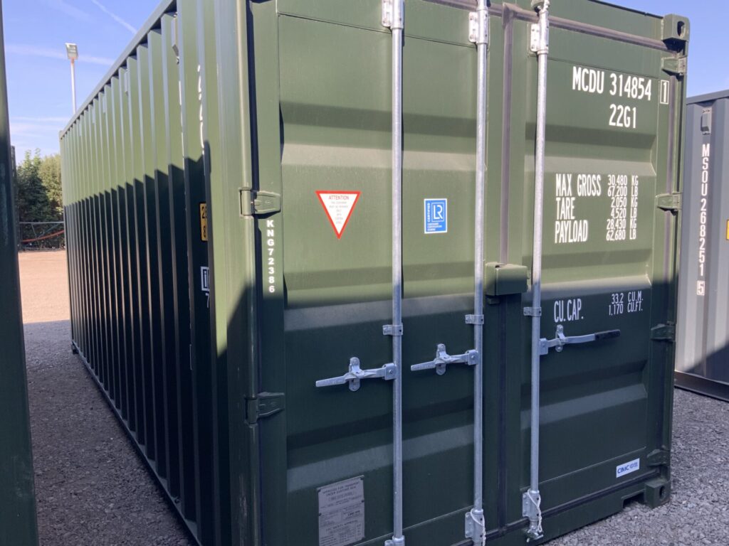 Brand new Bottle Green RAL6007 20ft one-trip ISO shipping container KNG72386 viewed from the front and side at the ContainerKing® depot, Lincolnshire.