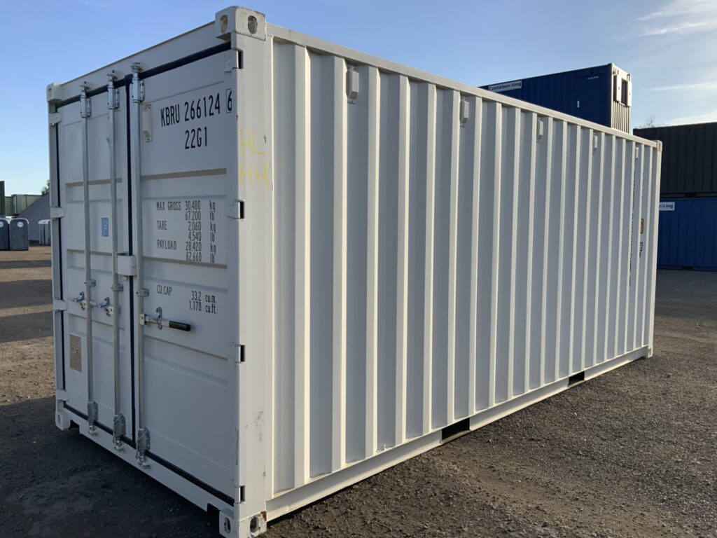 "Immaculate white one-trip 20ft ISO shipping container with black marine plywood floor and easy-open locking door gear."
