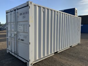 "Immaculate white one-trip 20ft ISO shipping container with black marine plywood floor and easy-open locking door gear."
