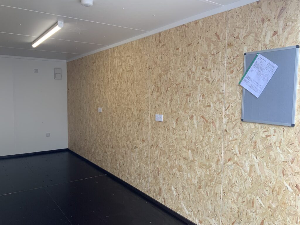 internal of a fully lined and insulated shipping container with electrics