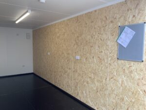 internal of a fully lined and insulated shipping container with electrics
