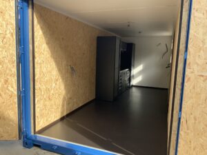 20ft portable workshop with shelving and workstation