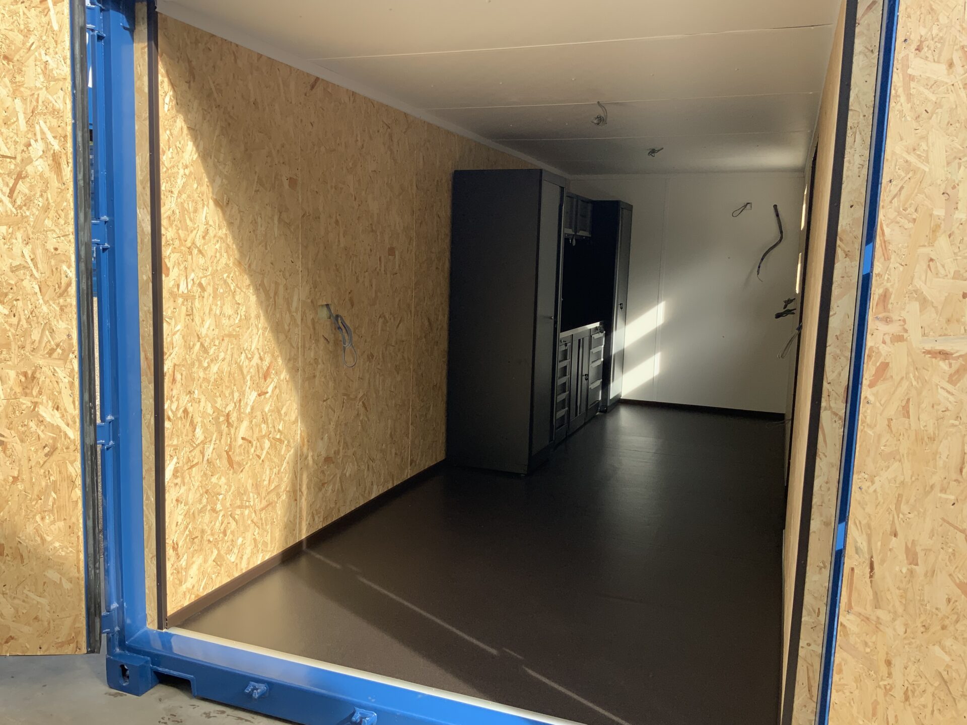 20ft portable workshop with shelving and workstation